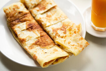Msemen Moroccan pancakes with honey, served with orange juice and coffee