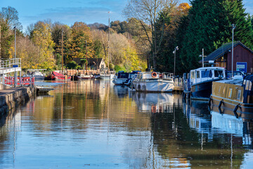 Fototapeta na wymiar Boats on the River Medway at Allington Locks just outside Maidstone in Kent, England