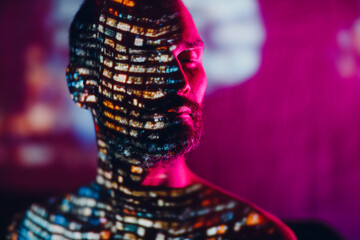 Adult man in the projection of light points on his body