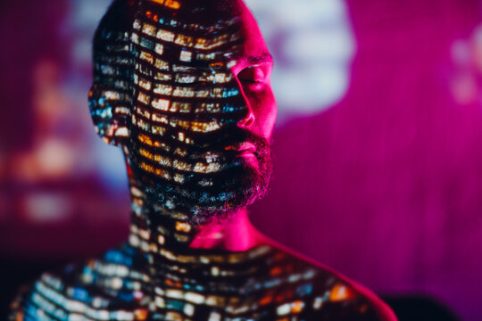 Adult man in the projection of light points on his body