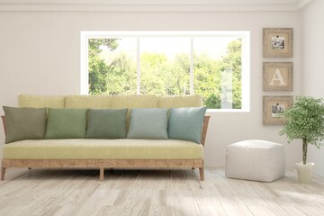Minimalist living room in white color with sofa and summer landscape in window. Scandinavian interior design. 3D illustration
