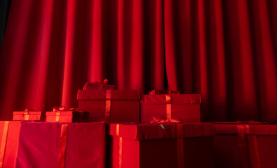 gifts on a background of red draped fabric