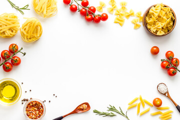 Frame of fettuccine with ingredients for cooking italian pasta