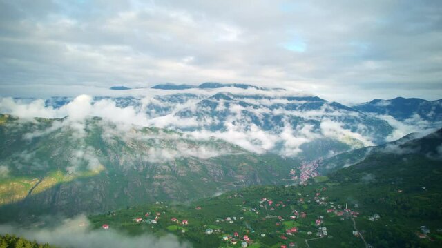 misty morning in the mountains hyper lapse, aerial view, time-lapse of idyllic green forest foggy mountain valley in Turkey