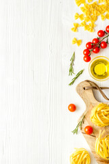 Pasta ingredients with tomatoes olive oil spices and herbs