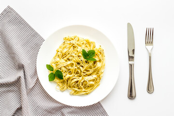 Plate of pasta fettuccine with cream sauce and herbs
