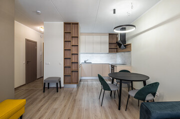 Modern light interior of studio apartment. Kitchen. Living room.
