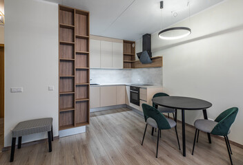 Modern light interior of studio apartment. Kitchen. Living room.