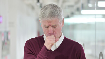Sick Middle Aged Businessman Coughing