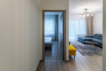 Modern light interior of living room in sapartment. Closed door.
