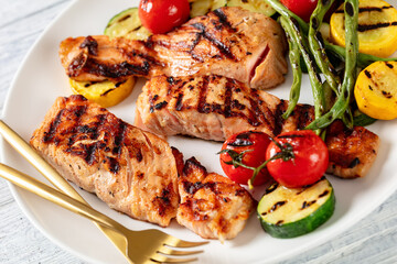 grilled salmon and vegetables on a plate