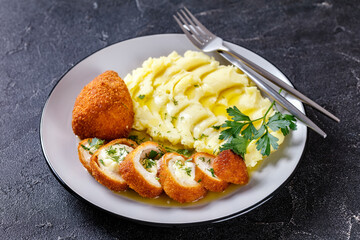 Chicken Kiev served with potato mash on a plate