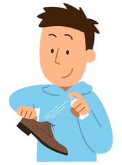 革靴にスプレーをかける男性1