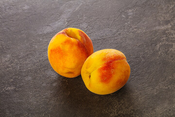 Two Sweet ripe tasty peaches