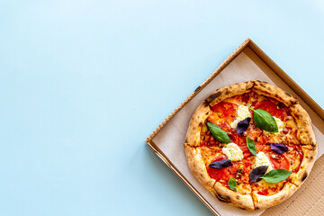 Margherita italian pizza with tomatoes cheese and basil, top view