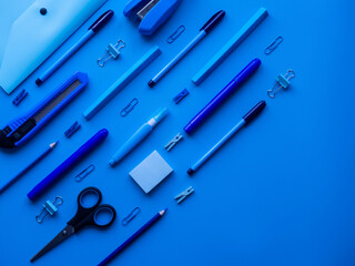 School, office supplies on a blue background. Preparation for school. Education concept. Place for...