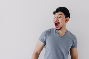 Obraz premium Shocked and surprised face of Asian man in isolated on white background.