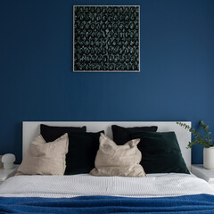 Modern art in bedroom with blue wall