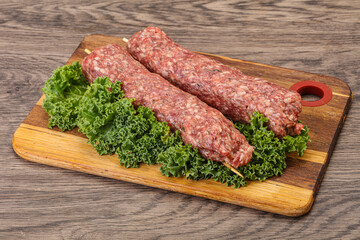 Raw minced beef kebab skewer
