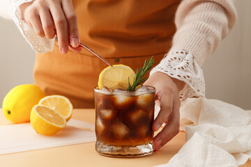 Barista making a lemon juice iced coffee