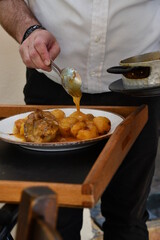 Preparing and serving meat and potatoes
