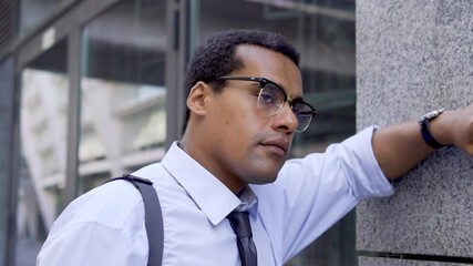 Irritated man loosening his tie and unbuttoning shirt, dismissal hiring problems