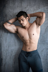 Obraz premium Portrait of asian man big muscle at the gym,Thailand people,Workout for good healthy,Body weight training,Fitness at the gym concept