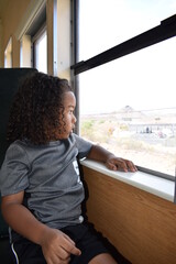 Fototapeta premium Child Looking Out Train Window