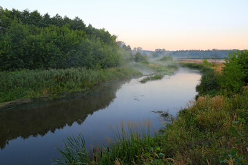 Fototapeta na wymiar foggy river in early morning time