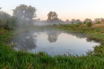 morning mist over lake surface