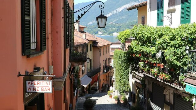 Picturesque and colorful old town street Salita Serbelloni in Bellagio town, Italy