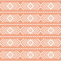 Seamless tribal pattern with lines, arrows, rhombus and triangles shapes decoration on coral background