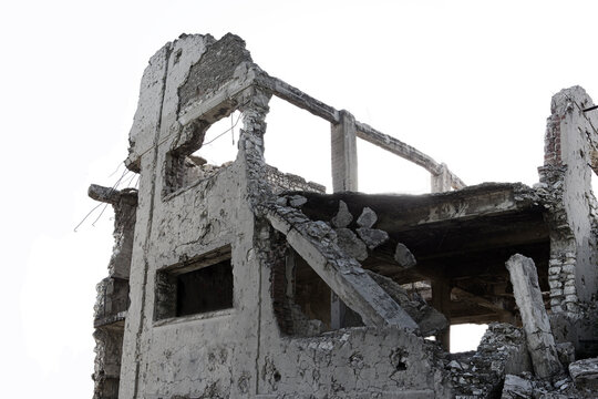 Building ruins isolated on white.Remains of the destroyed industrial building.Destroyed buildings in the war zone in the city of hims after battle.