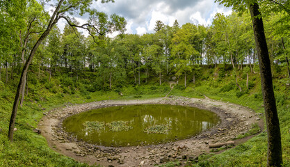 view of the meteor crater at Kaali Lake on Saaremaa Island in Estonia © makasana photo