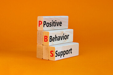 Positive behavior support symbol. Concept words Positive behavior support on wooden blocks on a beautiful orange background. Business, psychological and Positive behavior support concept. Copy space.