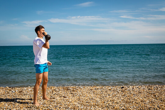 Kettlebell Lifts On A Beach