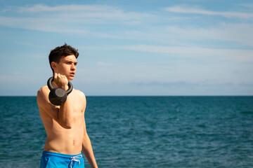 Kettlebell exercises on a beach