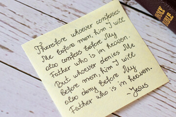 A closeup of a handwritten quote from Holy Bible. Acknowledge and confess Jesus before men....