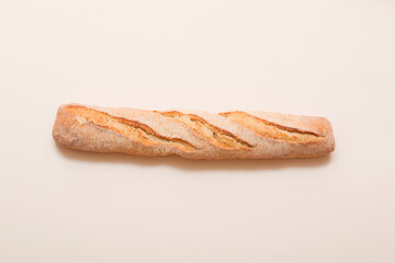 Soft fresh bread on a light background. Fragrant pastries. Baguette.