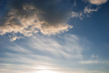 Naklejka na ściany i meble Blue sky with beautiful white heap clouds at sunset.