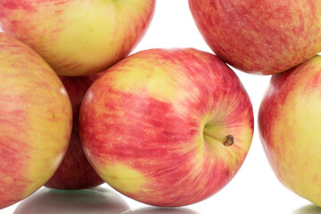 Several juicy organic apples, close-up, isolated on white.