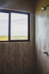Fototapeta premium A shower with a view through the window in the wall