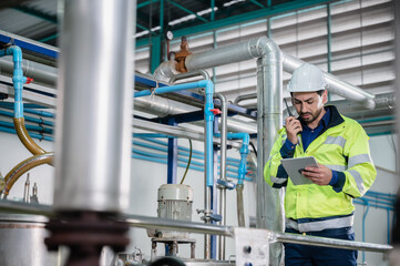 professional technician engineer working to control electrical power and safety service system,...