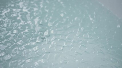 A bath full with ice cubes, close up