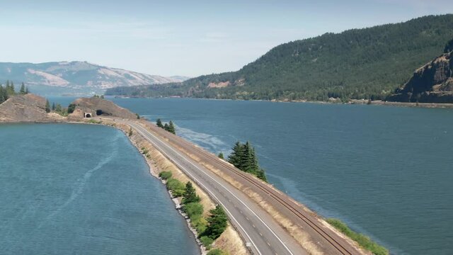 Aerial: Traffic On The Lewis And Clark Highway And Drano Lake Next To The Columbia River. Washington, USA