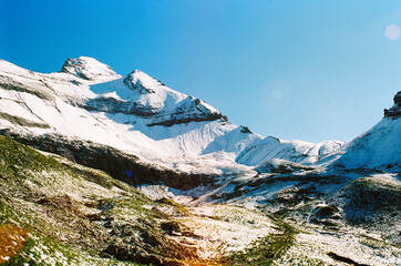 Snow covering the alpine summit of the mountain in swiss. hike during summer holiday.