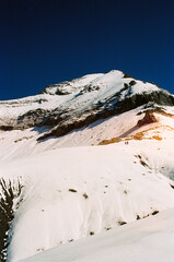 snow covered mountains. snow pic. hiking during summer holidays. snow on swiss mountain. dark blue sky.