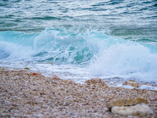 Waves on the beach with bays and rocks in Croatia