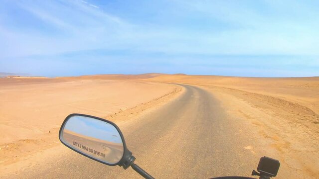 Motorcyclist in the Paracas Reserve in Ica - Pisco