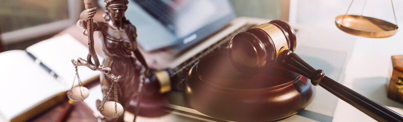 Business and lawyers discussing contract papers with brass scale on desk in office. Law, legal services, advice, justice and law concept picture with film grain effect